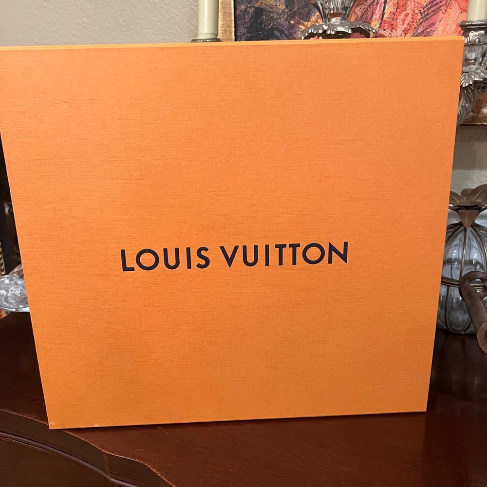 Authentic Louis Vuitton boxes with dust covers.